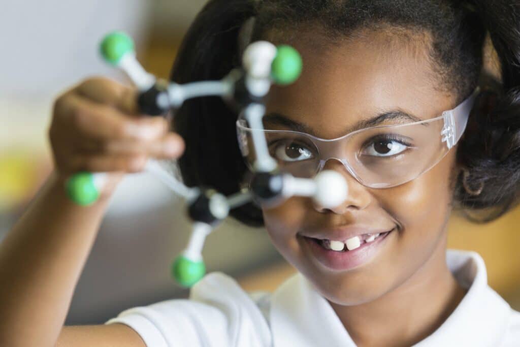 girl studies atomic structure