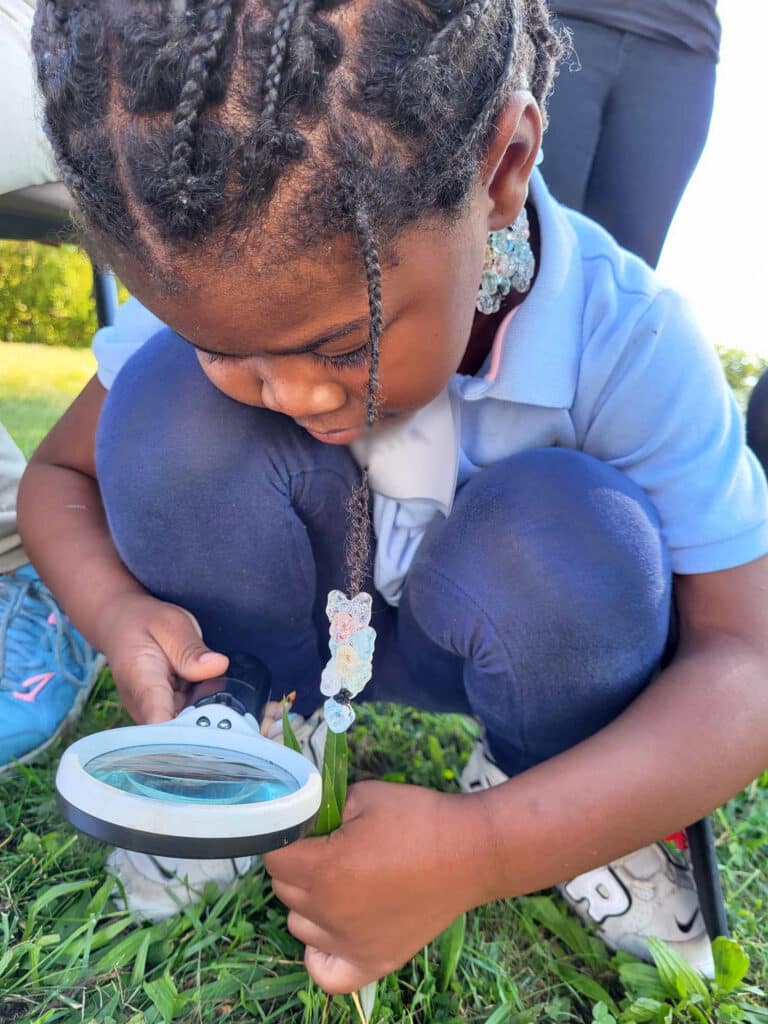 Student with magnifier